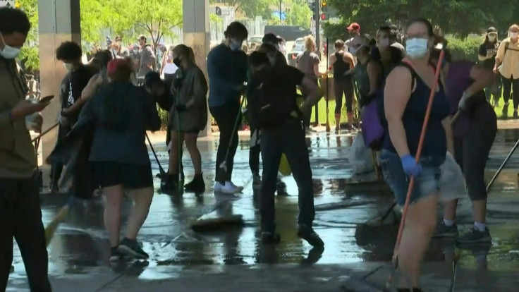 People help clean up bank and businesses in Minneapolis