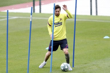 Messi back in Barcelona training