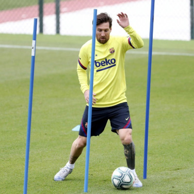 Messi back in Barcelona training