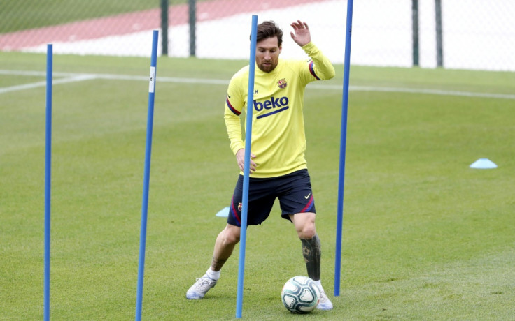 Messi back in Barcelona training