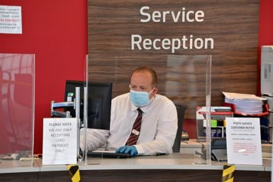 An employee set to receive customers
