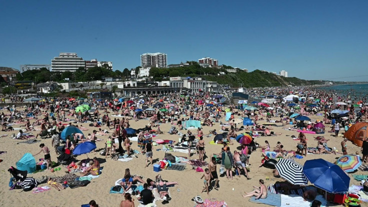 Thousands crowd a beach in UK