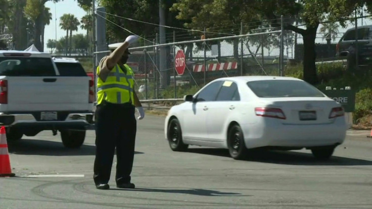 Vehicles move toward LA's Dodger Stadium