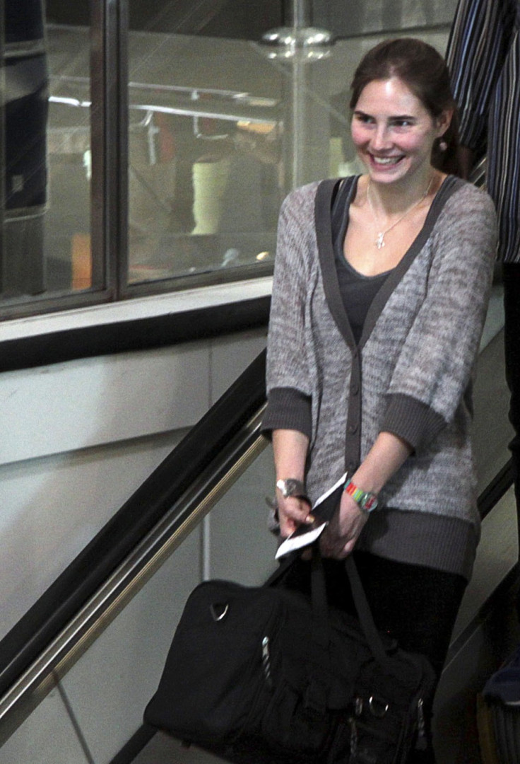 U.S. student Amanda Knox's smiles at the Leonardo Da Vinci airport in Fiumicino