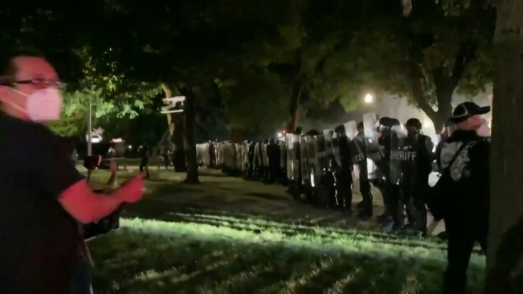 Police officers in front of courthouse, Kenosha