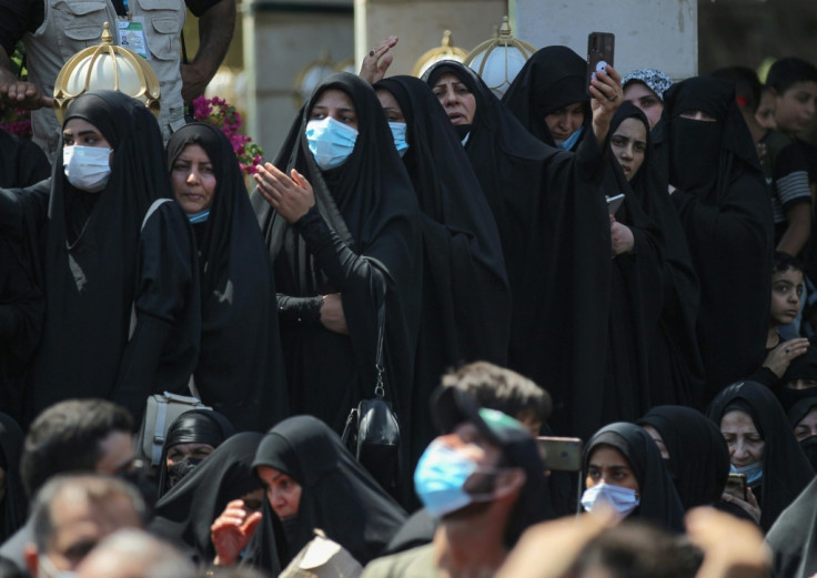 Iraqi Shiite Muslims in subdued Ashura gathering