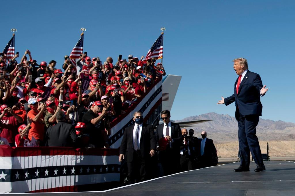 Trump shows no surrender in first post-election rally