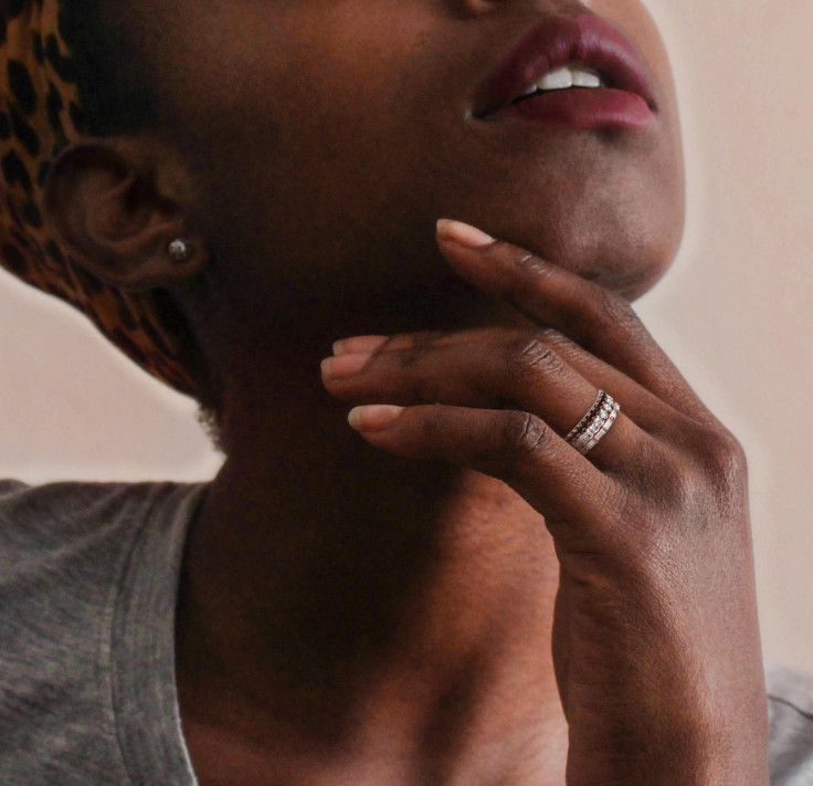 Women wearing a black diamond eternity ring Women wearing a black diamond eternity ring