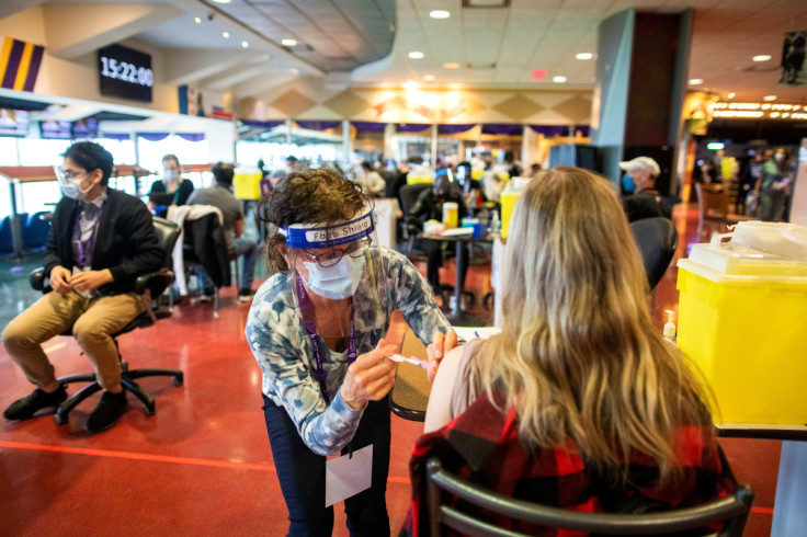 A healthcare worker administers the Pfizer/BioNTech coronavirus disease (COVID-19) vaccine, which was authorized by Canada to be used for children aged 12 to 15, at Woodbine Racetrack pop-up vaccine clinic in Toronto, Ontario, Canada May 5, 202