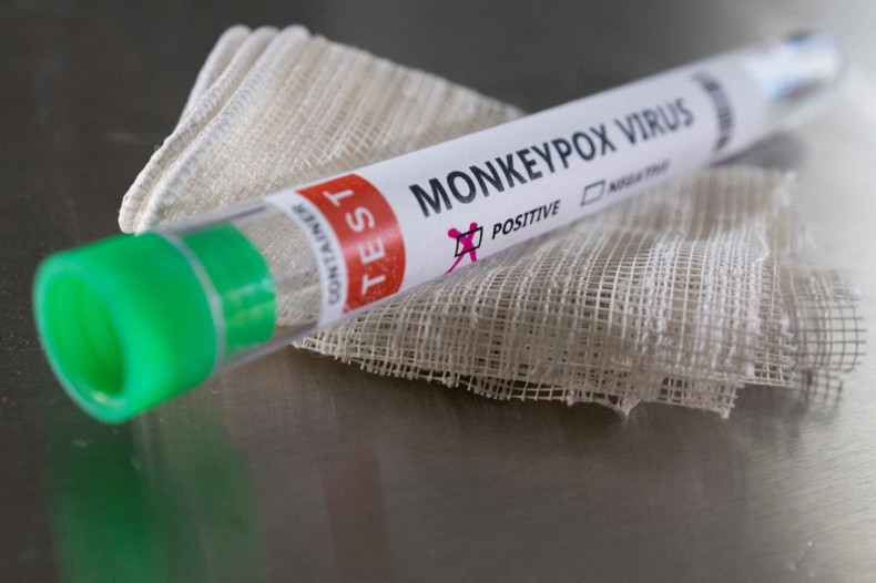 Illustration shows test tube labelled "Monkeypox virus positive
