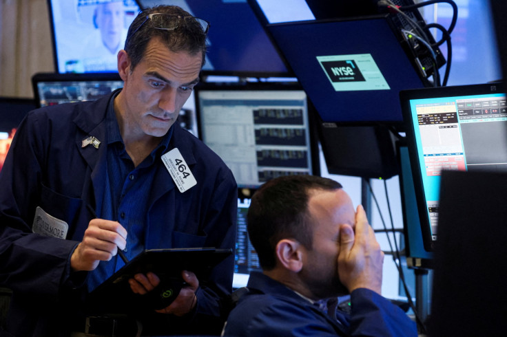 Traders work on the floor of the NYSE in New York