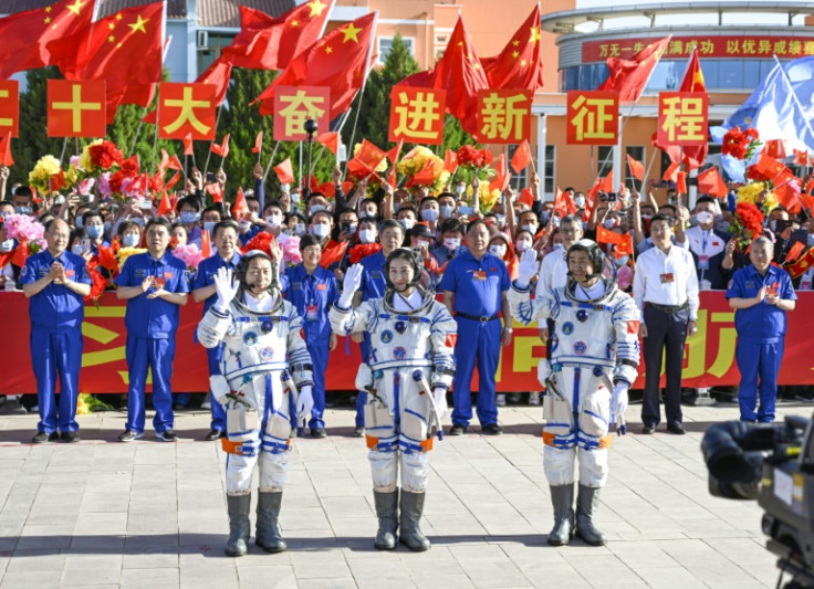 Chinese astronauts Cai Xuzhe (L to R), Chen Dong and Liu Yang take part in a ceremony prior to the launch of the Shenzhou-14 mission