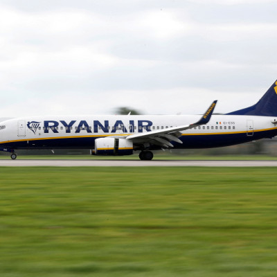 A Ryanair aircraft lands on the southern runway at Gatwick Airport in Crawley