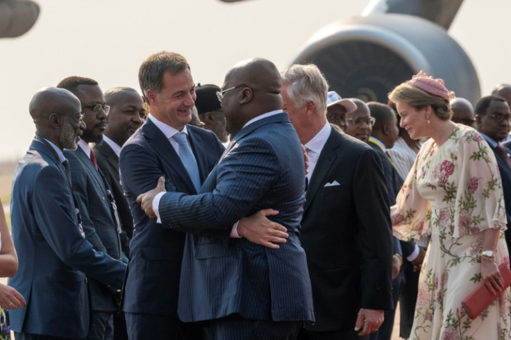 Hug: King Philippe was greeted by President Felix Tshisekedi at Kinshasa airport on Tuesday