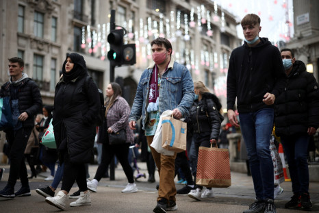 Shoppers walk through Oxford Circus, amid the coronavirus disease (COVID-19) outbreak in London