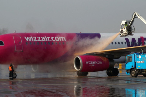 A Wizz Air plane is de-iced before flight at the Chopin International Airport in Warsaw