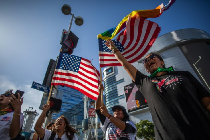 People protest in front of the LA Convention Center where North and South American leaders are gathered for the ninth Summit of the Americas