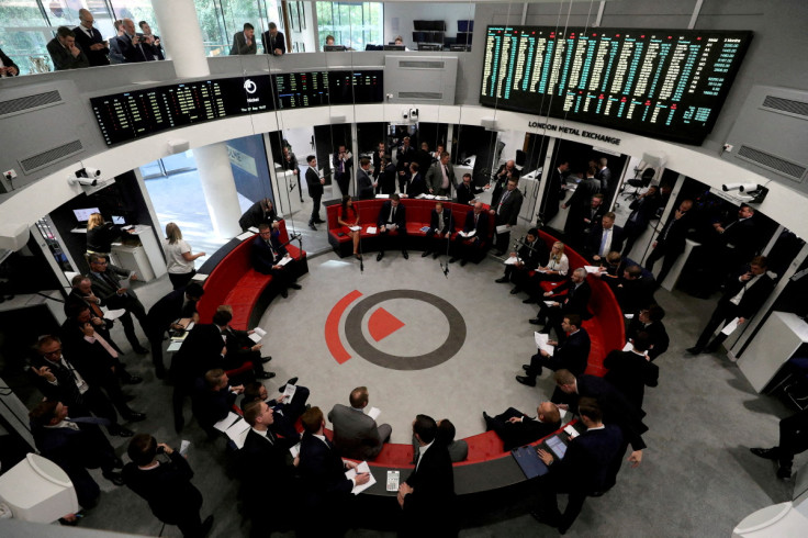 Traders work on the floor of the London Metal Exchange