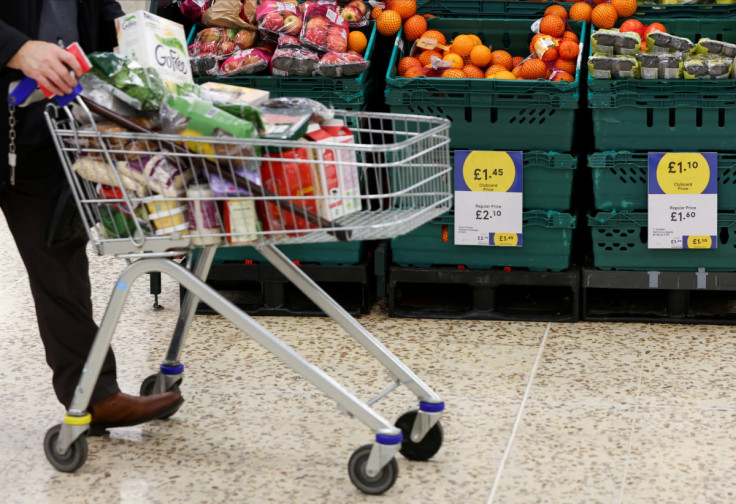 Clubcard branding is seen inside a branch of a Tesco Extra supermarket in London