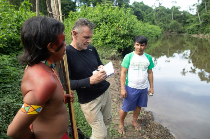Veteran foreign correspondent Dom Phillips talks to two men in Roraima State, Brazil in November 2019