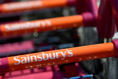 Branding is seen on a shopping trolley at a branch of the Sainsbury's supermarket in London