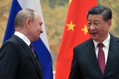 Xi Jinping (R), who has described Vladimir Putin as as 'old friend', invited the Russian leader to the opening ceremony of the Beijing Winter Olympics in early February