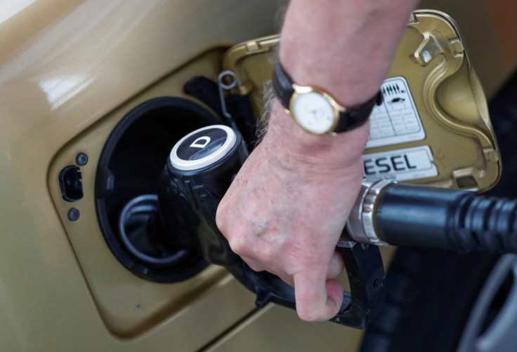 A driver fills a car at an Envi petrol station in Budakalasz