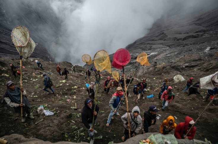 Some villagers tried to snatch the offerings out of the air before they disappeared into the smokey void