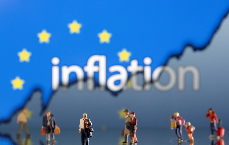 Illustration shows small figurines, displayed word "Inflation", EU flag and rising stock graph