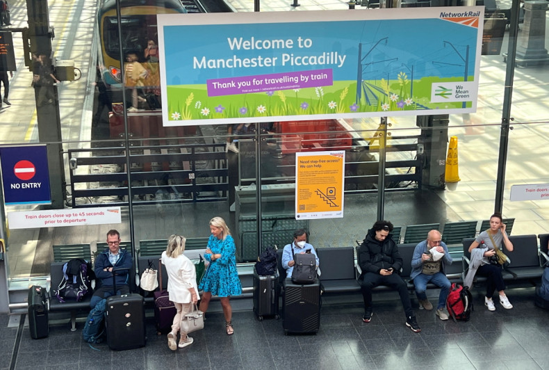 Passengers travel ahead of a planned national strike by rail workers in Manchester