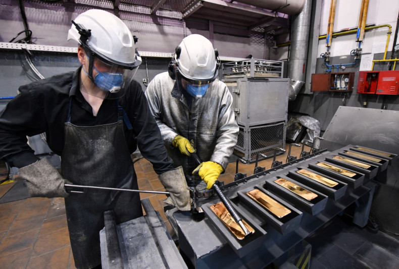 Employees process ingots of 99.99 percent pure gold at the Krastsvetmet non-ferrous metals plant in Krasnoyarsk