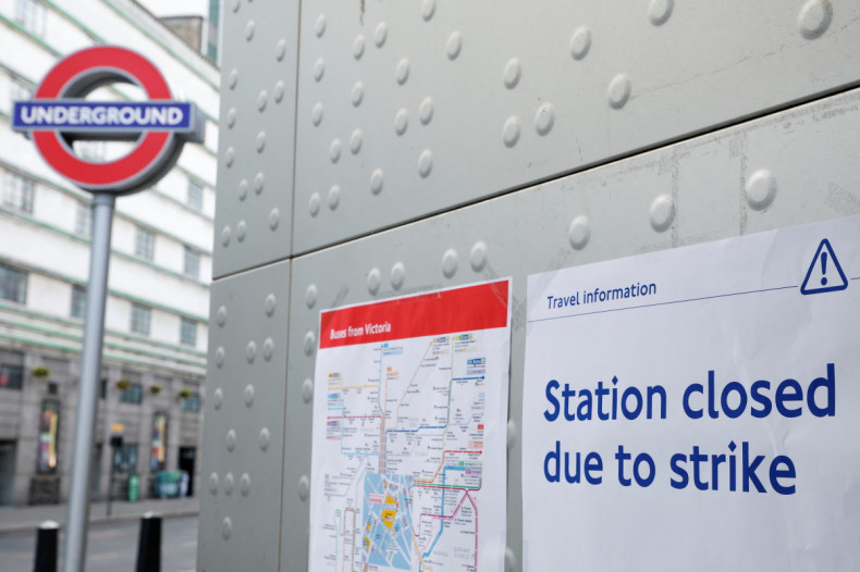 An informational poster is placed outside Victoria Underground Station during a strike, in London
