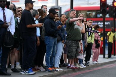  People queue for buses at Victoria Station in London on June 21 2022 during three days of strikes that will see more than half of the UK’s rail network suspended.