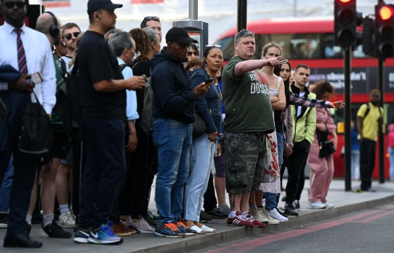 People queue for buses at Victoria Station in London on June 21 2022 during three days of strikes that will see more than half of the UK’s rail network suspended.