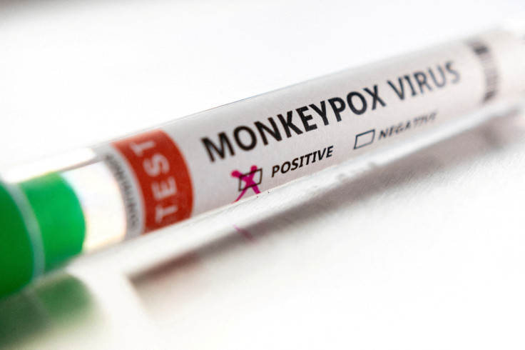 Illustration shows test tube labelled "Monkeypox virus positive