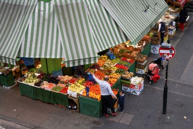 A man shops for fruit and vegetables in Brixton, London