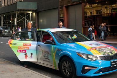 A rideshare car with ads wrapped by mobile advertisement company Carvertise, in New York City