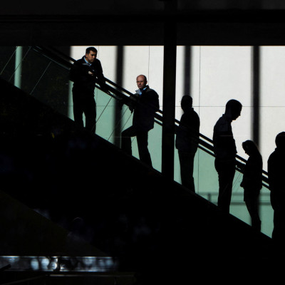 People ride the escalators in the JP Morgan & Chase Co. building in New York