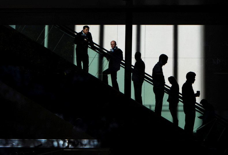 People ride the escalators in the JP Morgan & Chase Co. building in New York