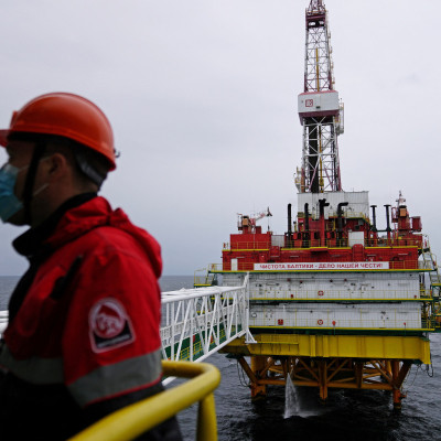 An employee is seen at an oil platform operated by Lukoil company at the Kravtsovskoye oilfield in the Baltic Sea