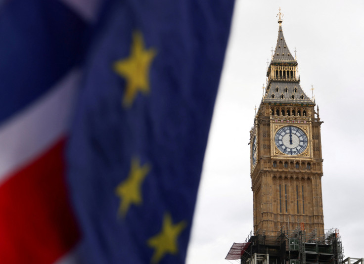 The EU and Union Jack flags are flown outside the Houses of Parliament in London