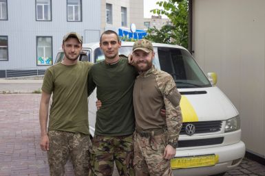 Soldier who returned from Sievierodonetsk poses for a picture with friends in Slovyansk