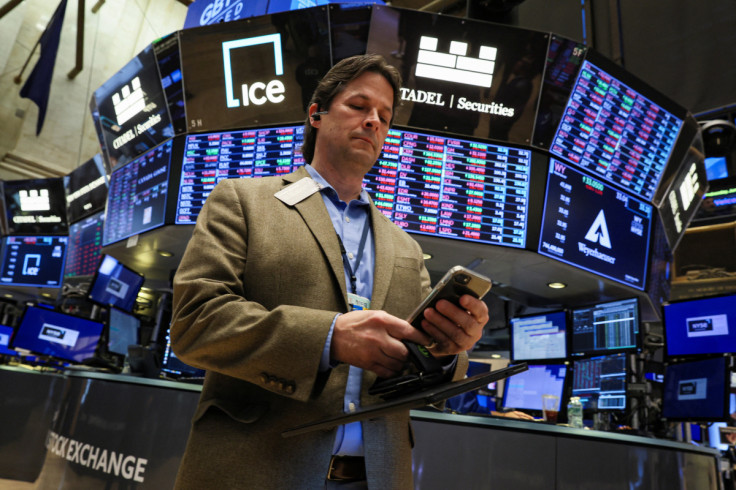 Traders work on the floor of the NYSE in New York