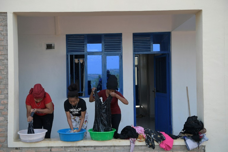 Eritrean asylum seekers wash their clothes at the  Gashora camp