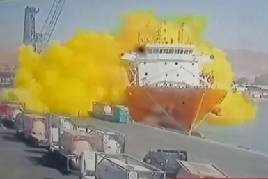 Footage on state TV showed a large cylinder plunging from a crane on a moored vessel, causing a violent explosion of yellow gas in Jordan's Aqaba port