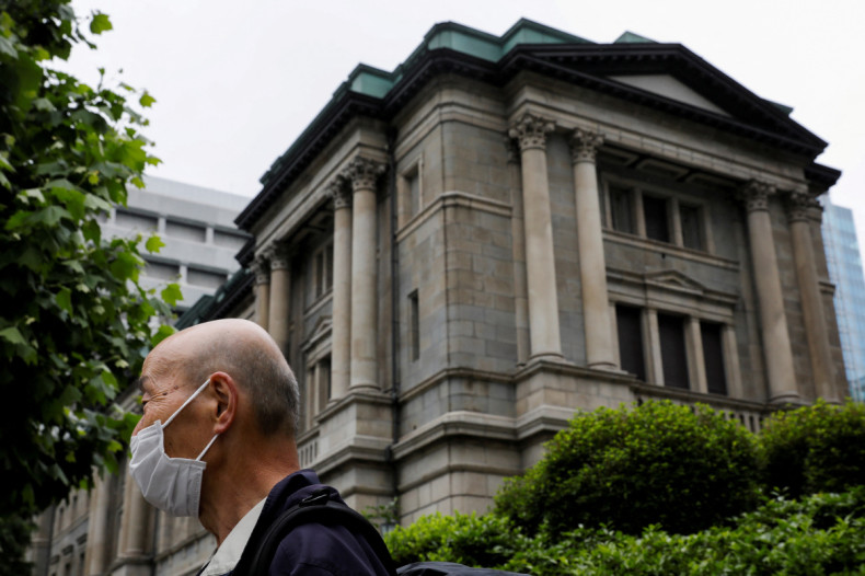 A man wearing a protective mask stands in front of the headquarters of Bank of Japan amid the coronavirus disease (COVID-19) outbreak in Tokyo