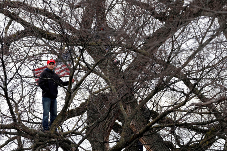 A supporter of U.S. President Donald Trump attends a rally organized at the White House ellipse to contest the certification by the U.S. Congress of the results of the 2020 U.S. presidential election at the Washington Monument by the White Hous