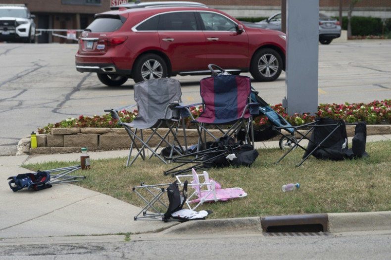 Abandoned lawn chairs stand along the streets at the scene of the Fourth of July parade shooting in Highland Park, Illinois on July 4, 2022