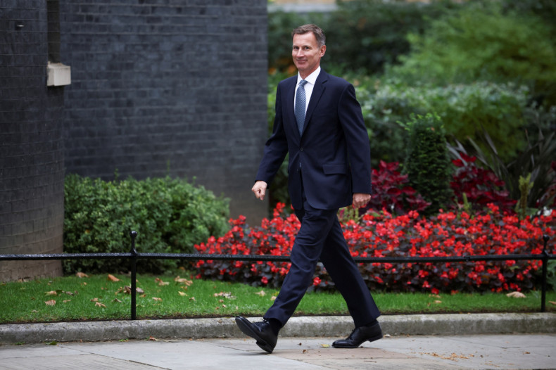 MP Jeremy Hunt walks outside Downing Street in London