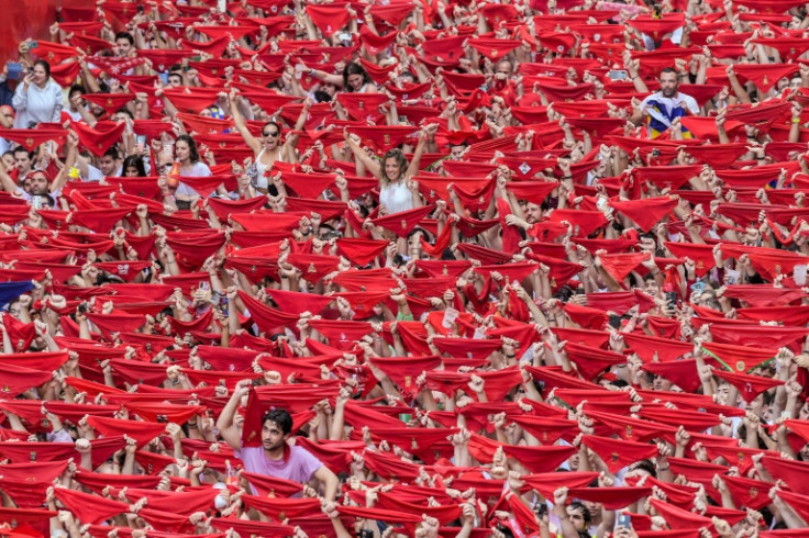 After the 'chupinazo' starting rocket was fired at midday from Pamplona town hall, thousands erupted in celebration